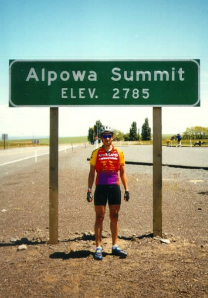Standing below the sign for the Alpowa Summit.